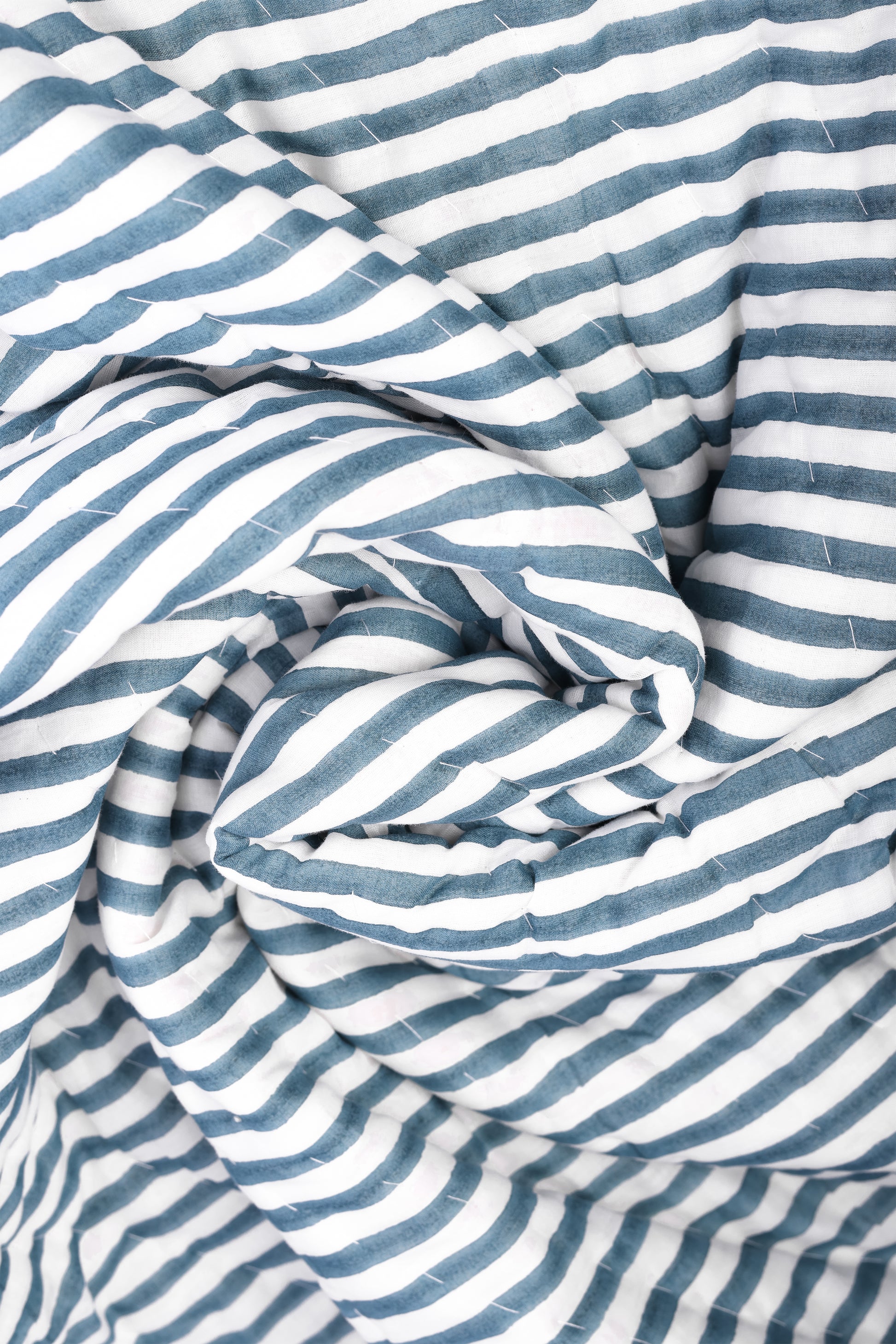 Close-up of blue and white striped jaipuri quits