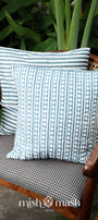 2 blue cushion covers kept on a chair
