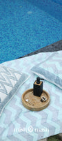 Blue double bed sheet with chevron pattern and matchig cotton pillow cover lying next to a pool