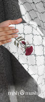 Embroidered bath towel for men with floral design held by a hand, brand 'mish mash' visible. Women towel. 
