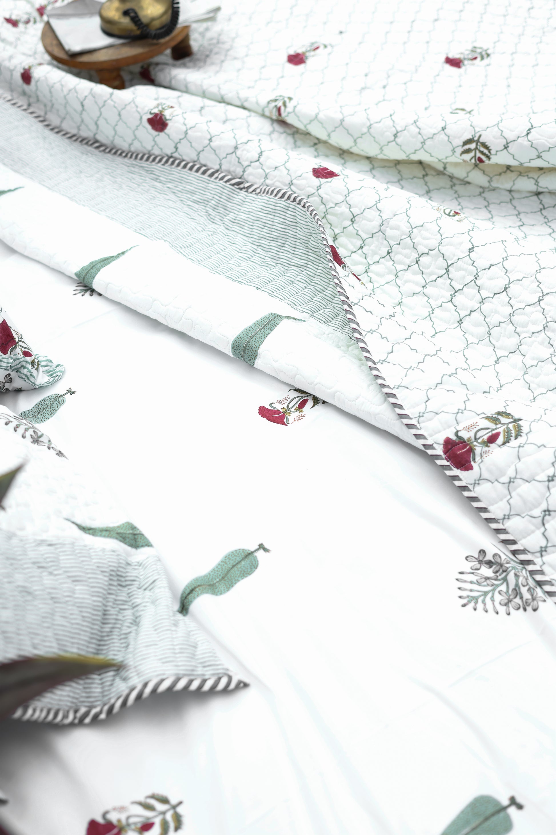 Floral printed double bed bedsheet with green leaves and red flowers handblock printed, made in pure cotton. Buy Jaipur bedsheets.