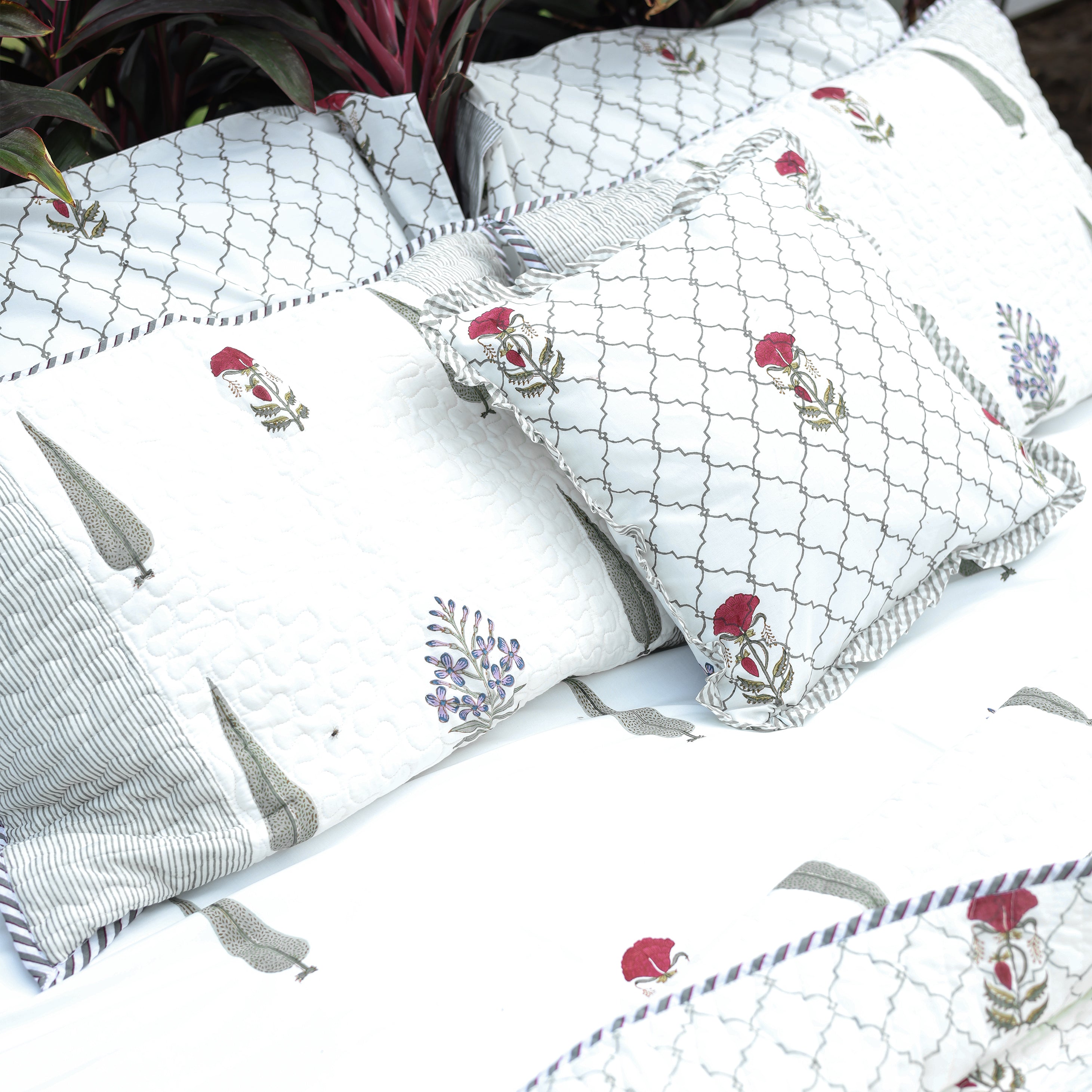 Set of decorative pillows with floral double bed bedsheet made in Jaipur. Fabindia bedsheet.