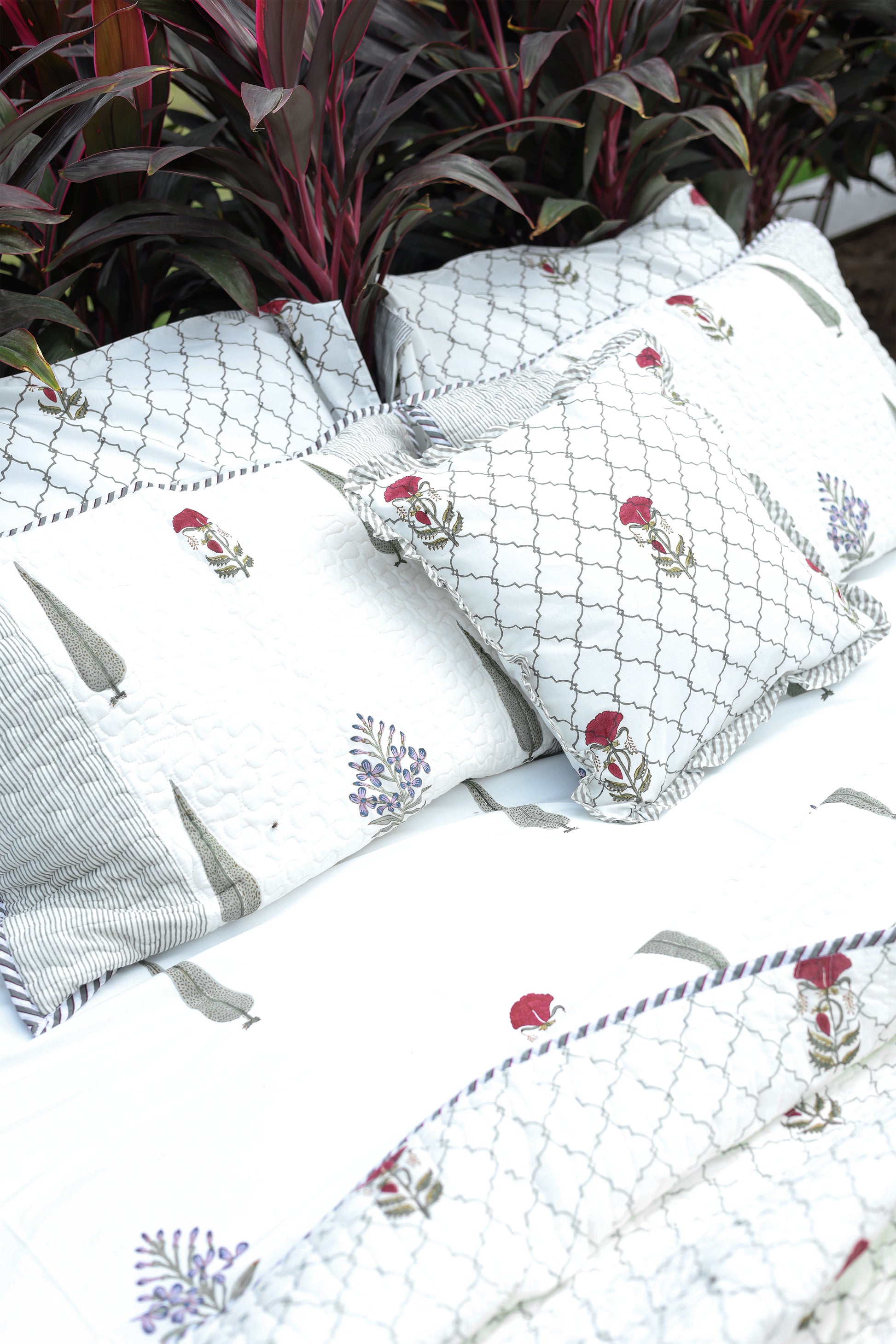 Set of decorative pillows with floral double bed bedsheet made in Jaipur. Fabindia bedsheet.