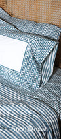 Double bed bedsheet with matching cotton pillows on a bed. Buy jaipuri bedsheet. Cotton bedsheet.