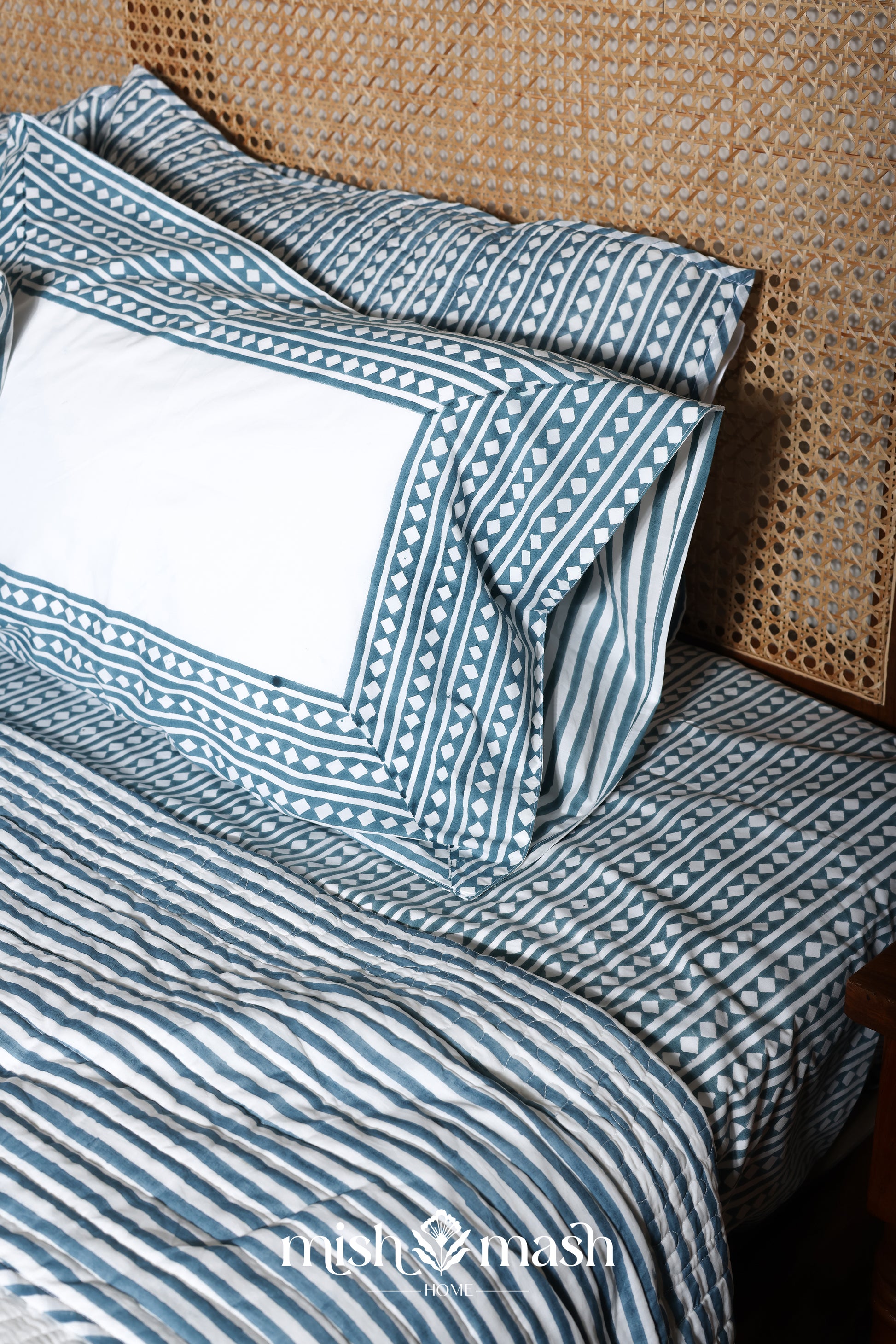 Double bed bedsheet with matching cotton pillows on a bed. Buy jaipuri bedsheet. Cotton bedsheet.