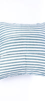 Striped blue and white cotton cushion covers on a white background