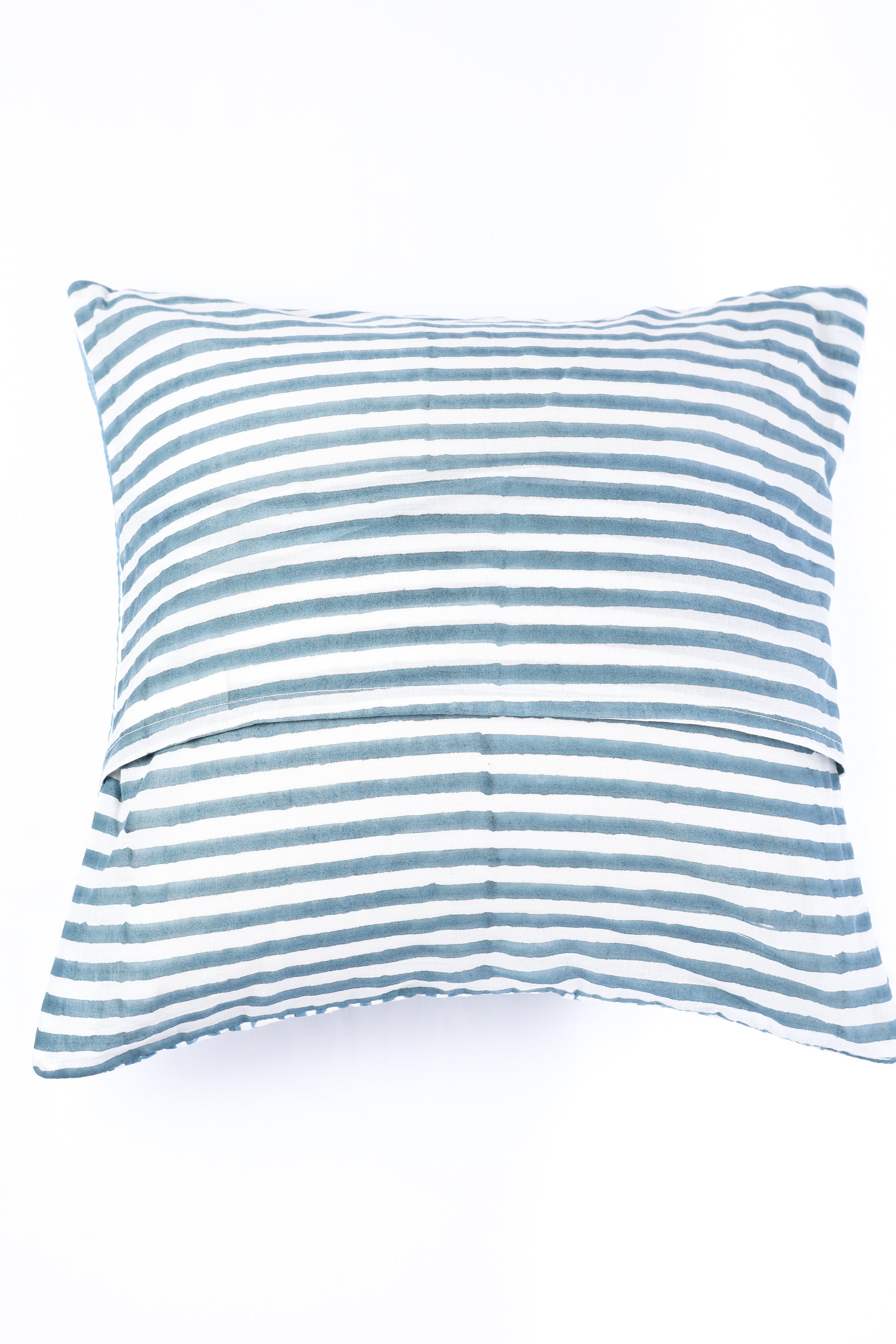 Striped blue and white cotton cushion covers on a white background