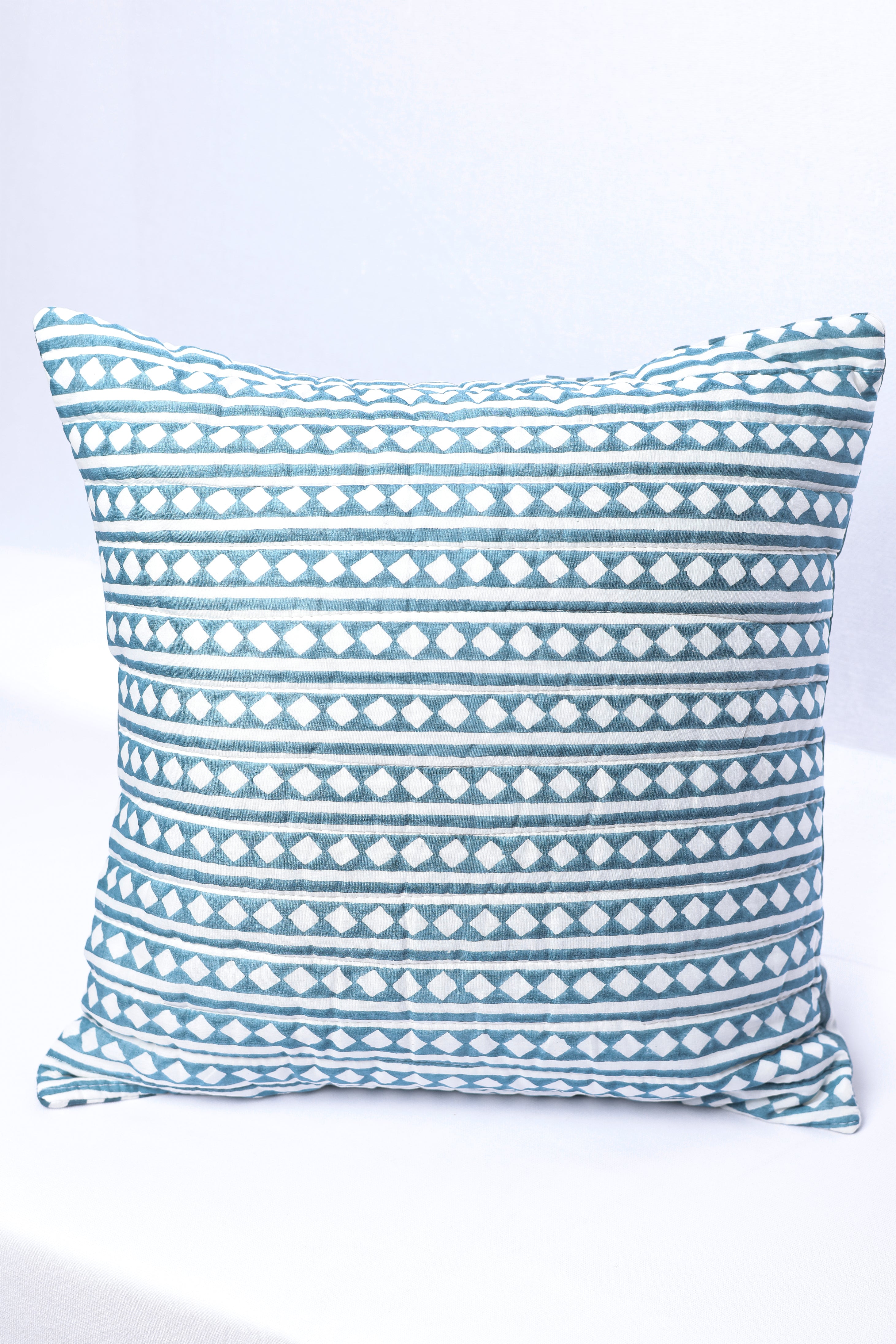 Festive cushion covers online with blue and white geometric pattern on a white background