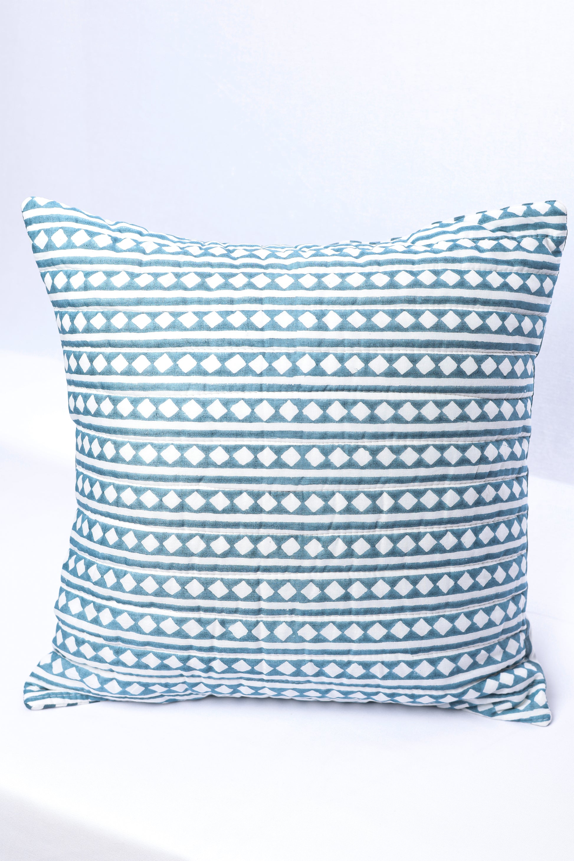 Festive cushion covers online with blue and white geometric pattern on a white background