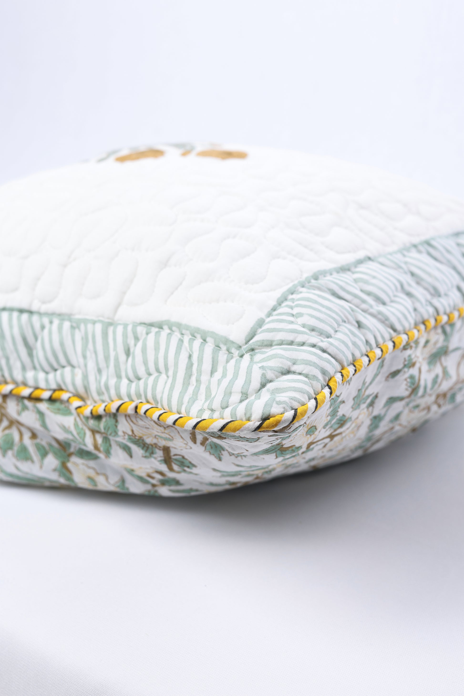 cushion covers online with a yellow piping on a white background