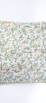 Floral patterned cushion covers online with yellow trim on a white background