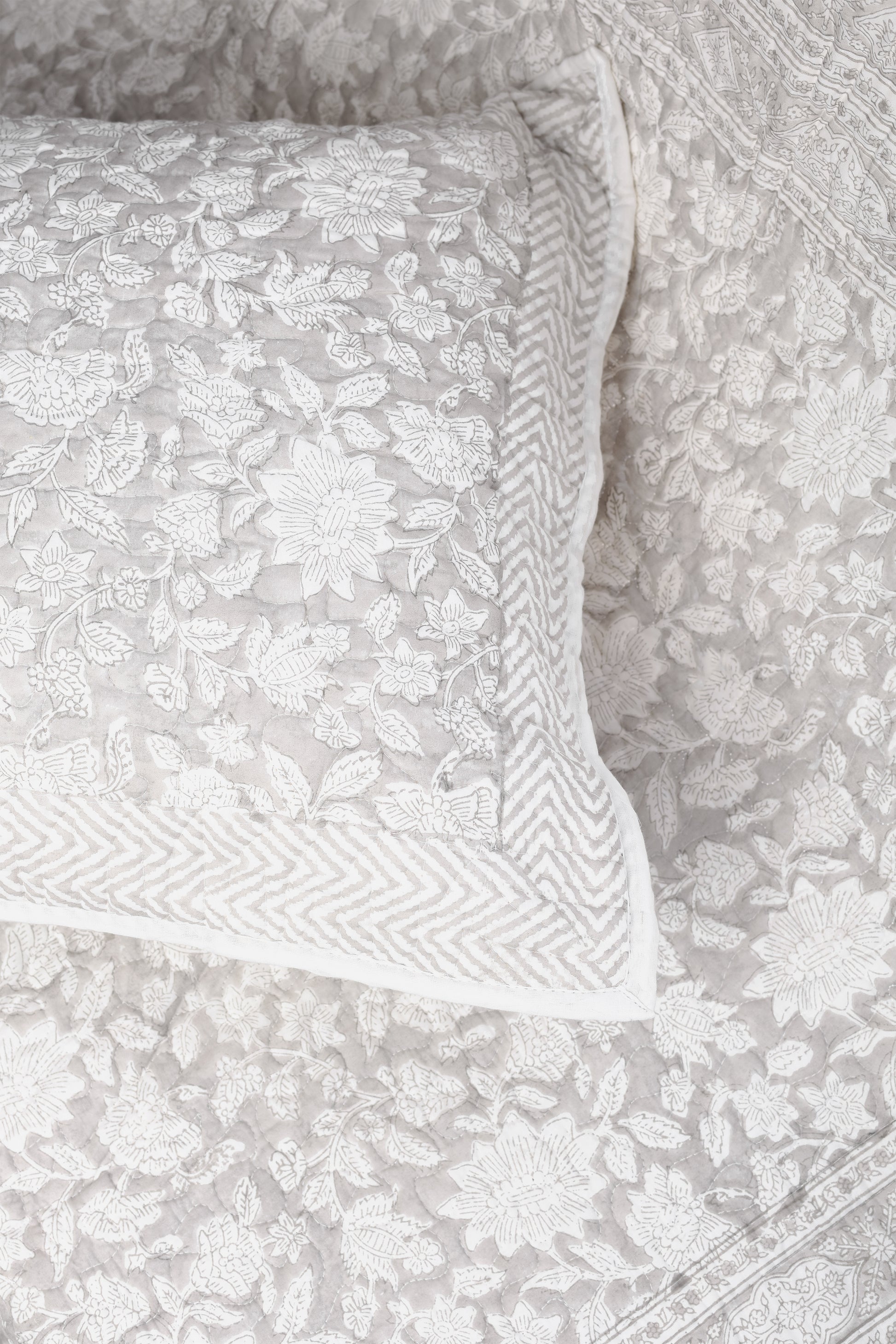 Floral patterned grey bed spread online with grey and white matching pillow 