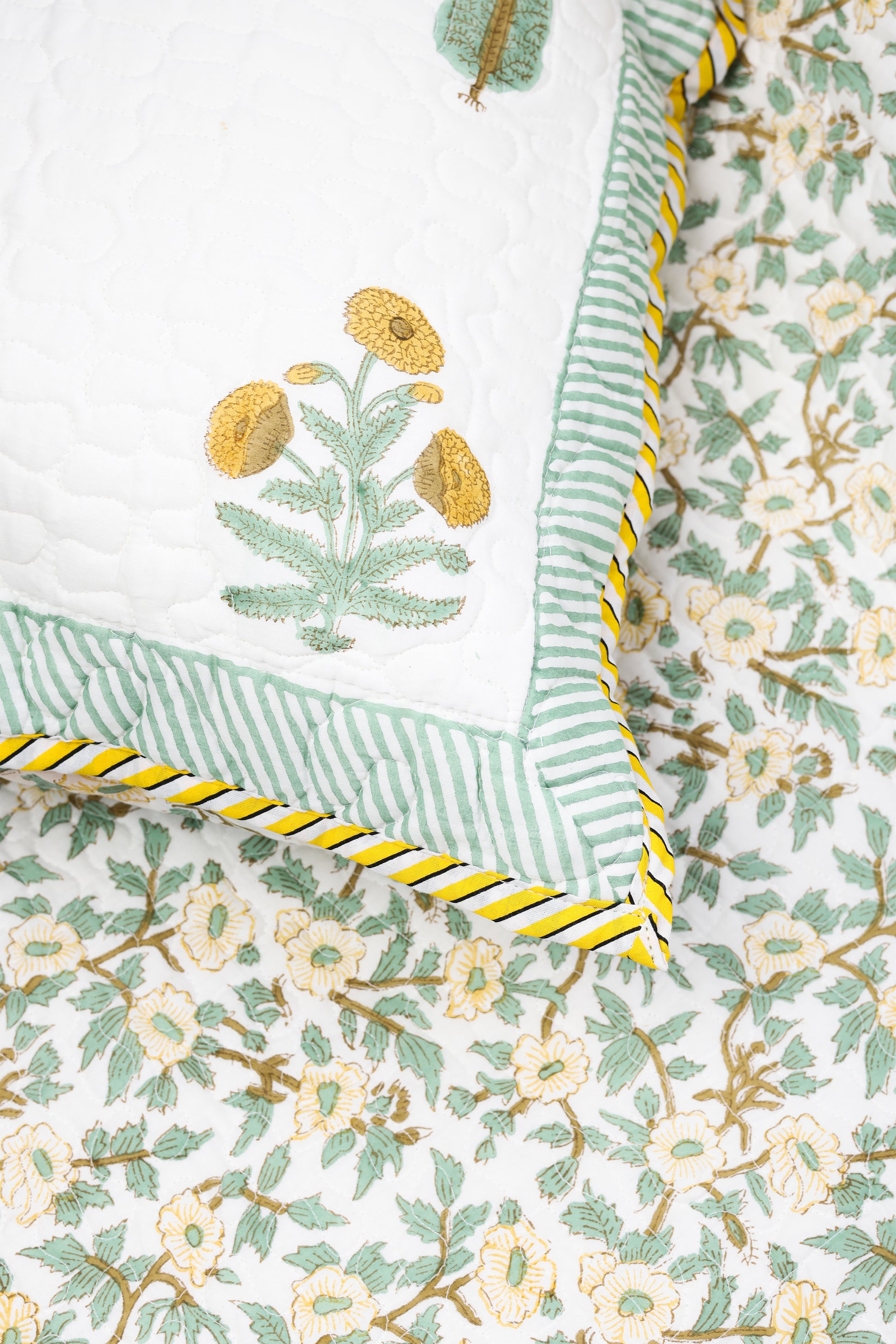 Close-up of floral bed cover set made in pure cotton. buy bedspeads online.