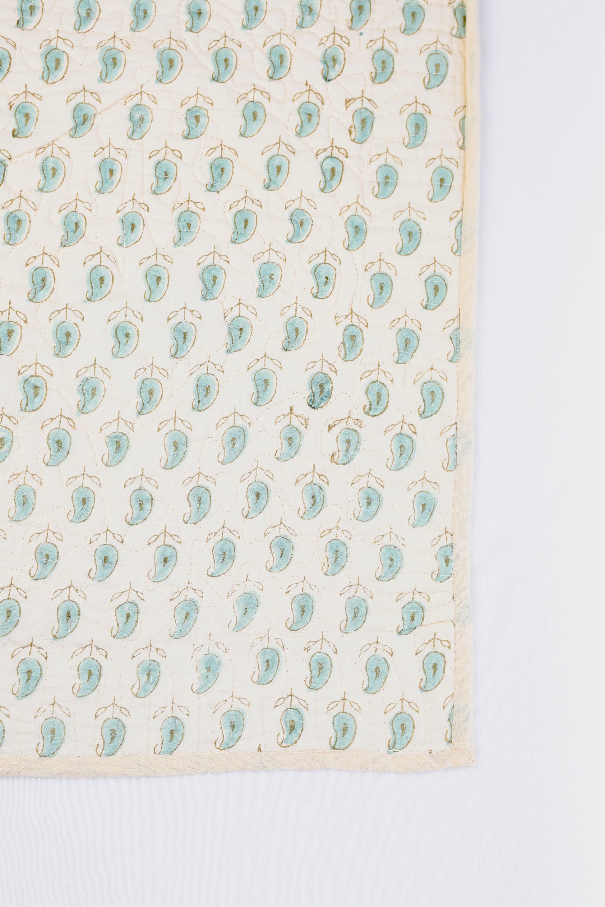 Quilted cotton luxury bed spread online with green paisley motifs