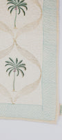 Cotton bed cover online with palm tree design on a light yellow fabric