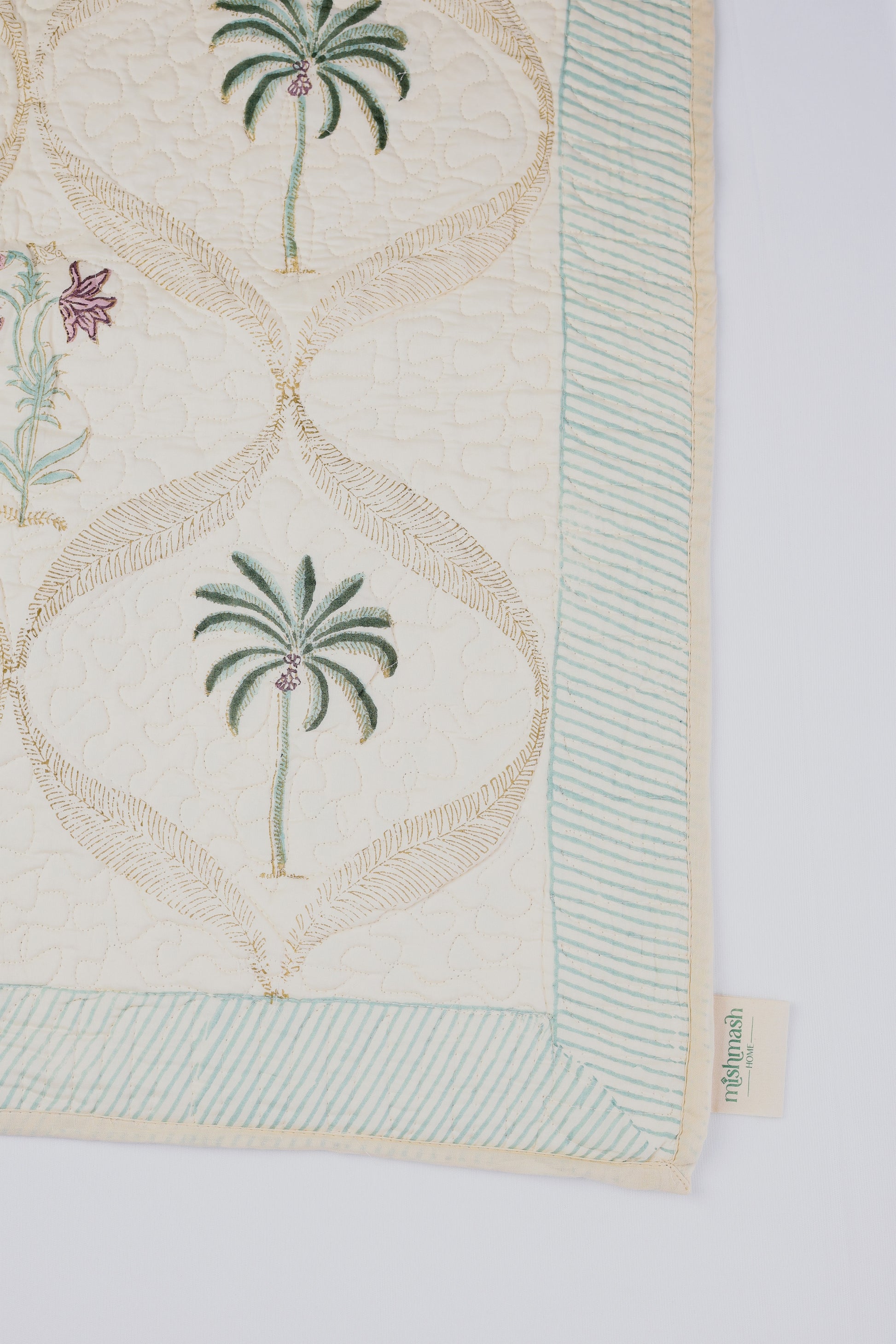Cotton bed cover online with palm tree design on a light yellow fabric