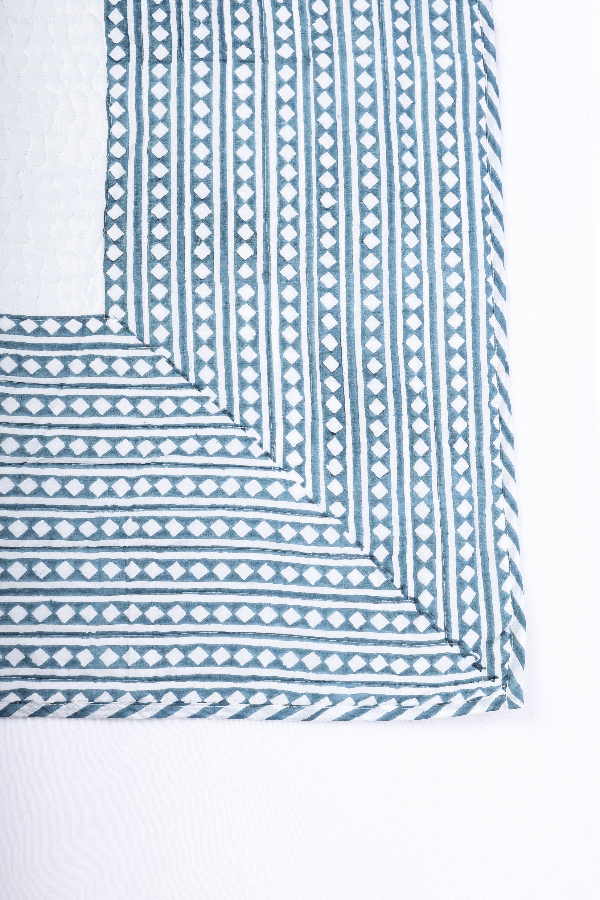 Cotton bed cover with blue and white geometric pattern hand block printed. Buy luxury bedspread online.