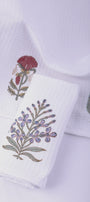 White hand napkins with floral block prints. Good earth towels.