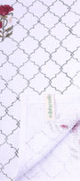 Bath linen with a floral pattern and brand name. Quick dry towel for women.