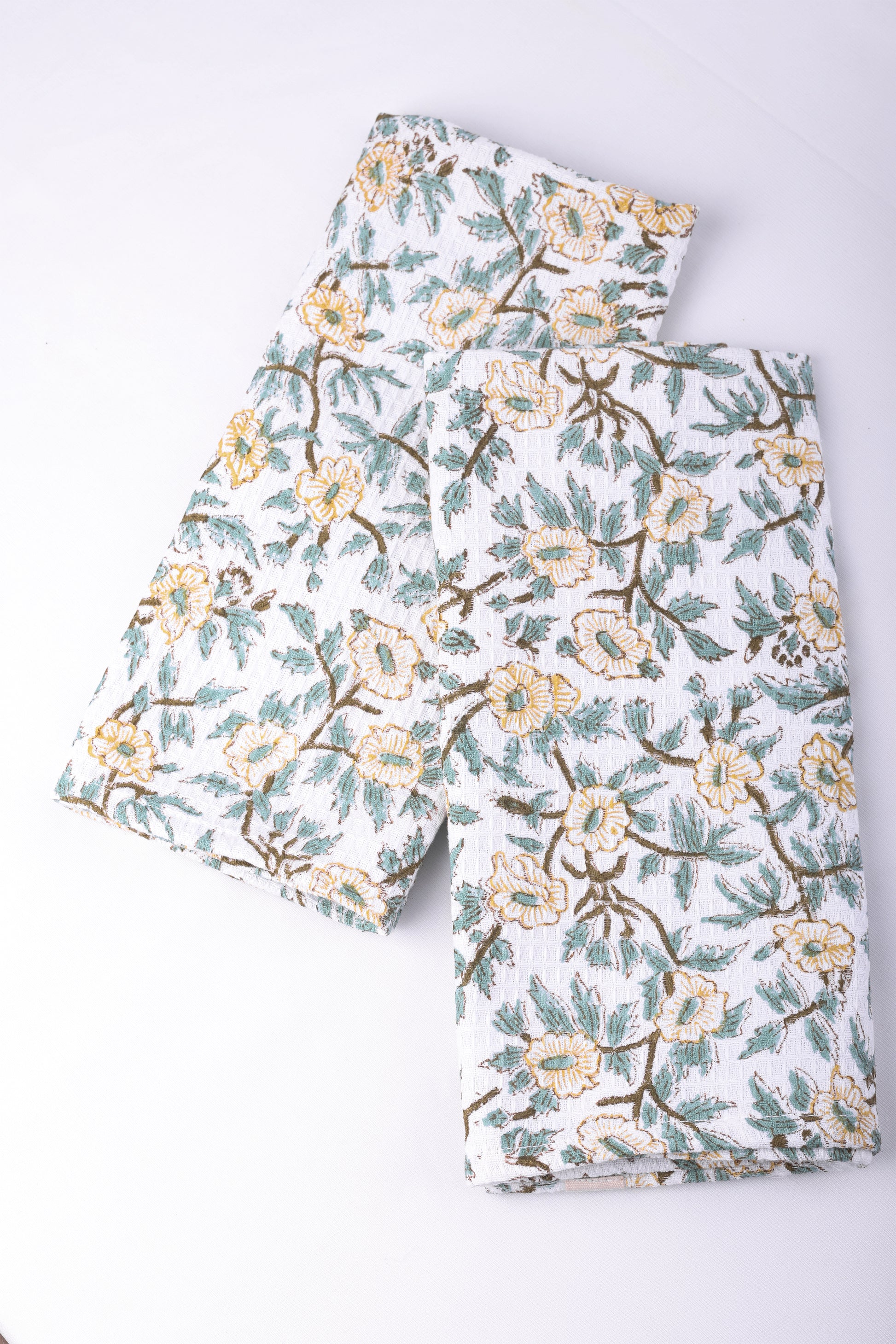 Floral hand towels roll on a white background. Quick dry towels.