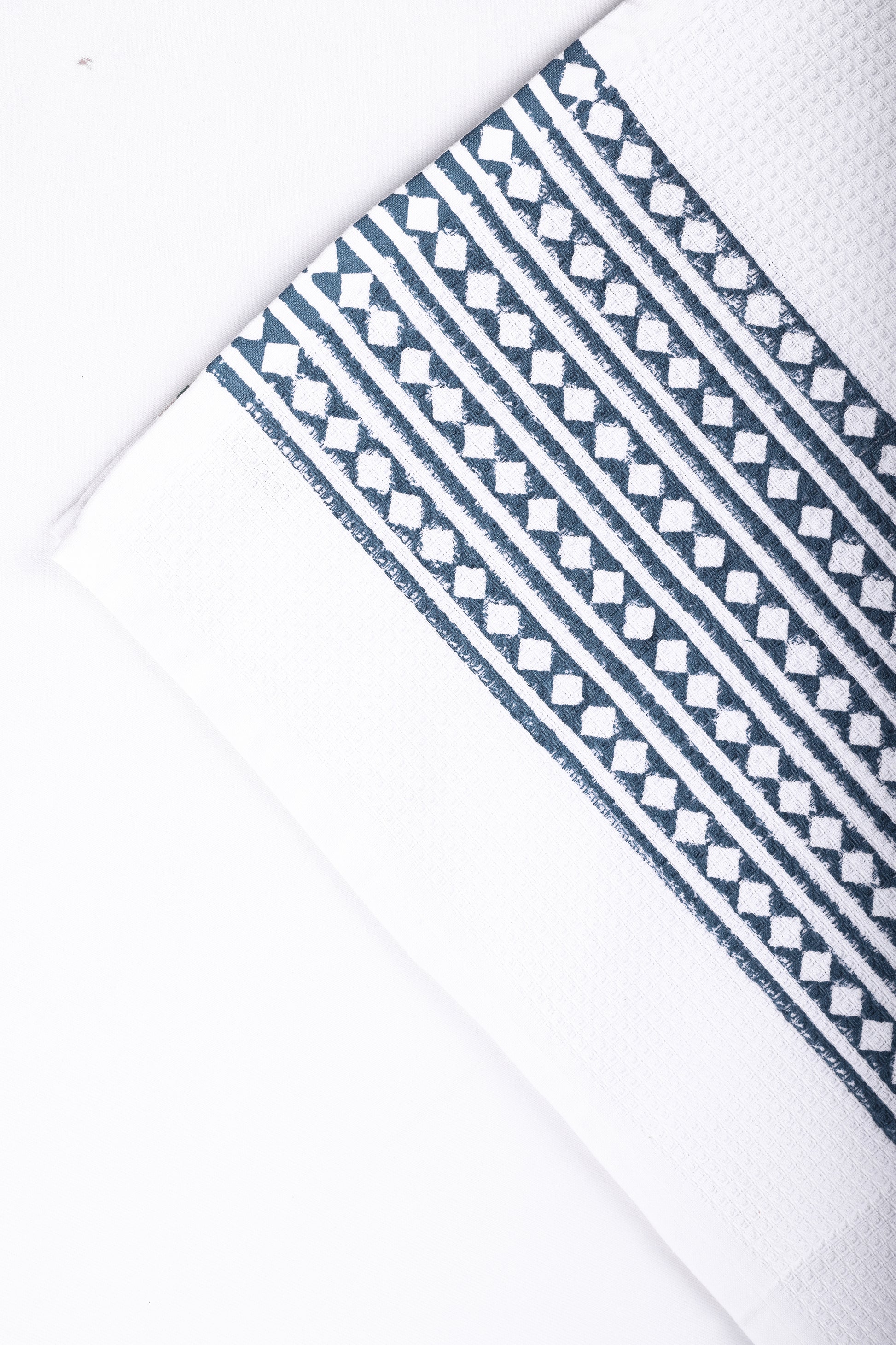 Blue and white block printed bath towel for men in cotton waffle. buy towel online.