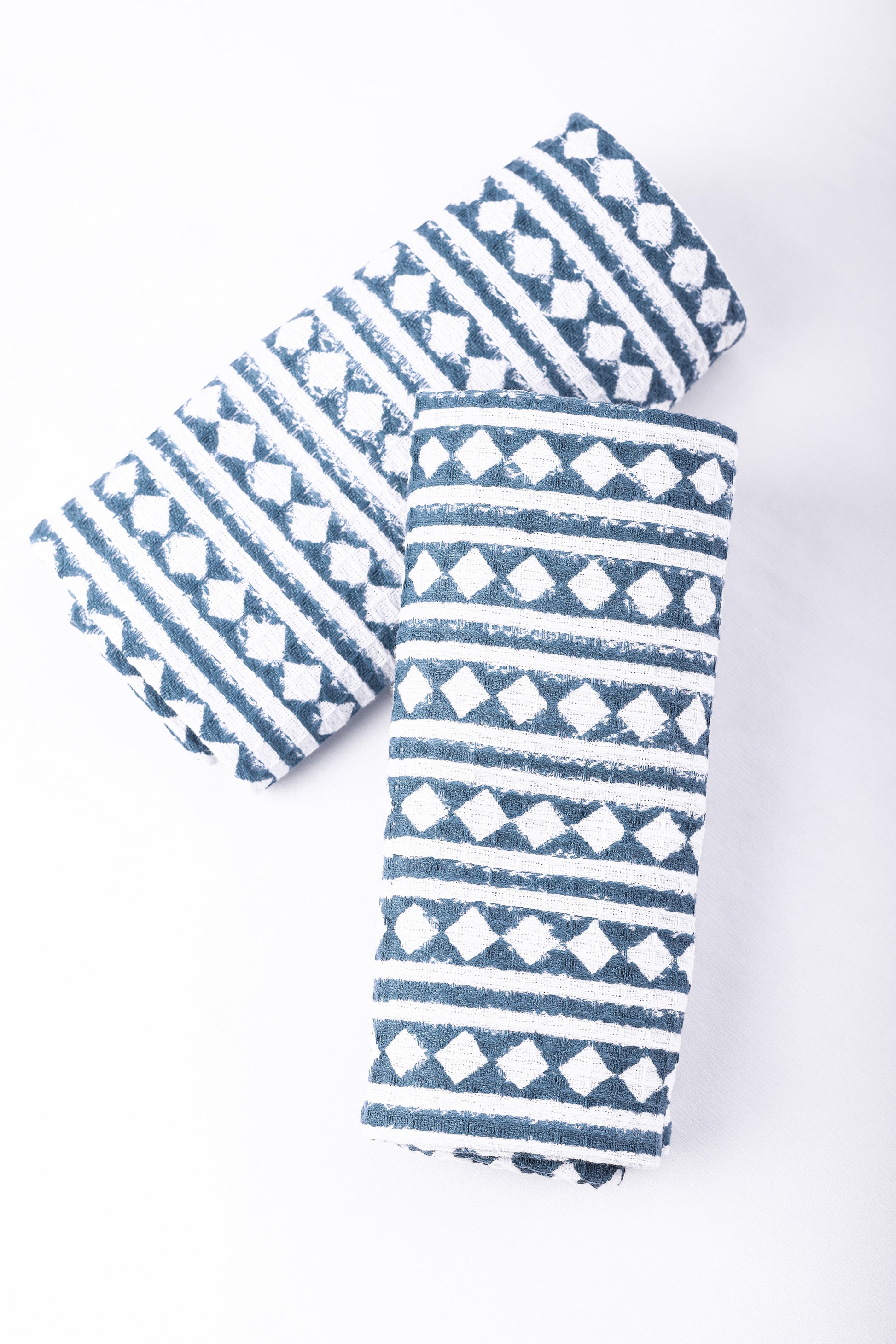 Blue and white cotton hand towels set on a white background. Buy bath linen.