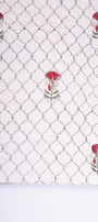 White winter quilt with red and green jaal pattern on a white background. All seasons jaipur razai. 