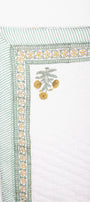 Decorative jaipur razai with floral print on a white background. Perfect as a housewarming gift.
