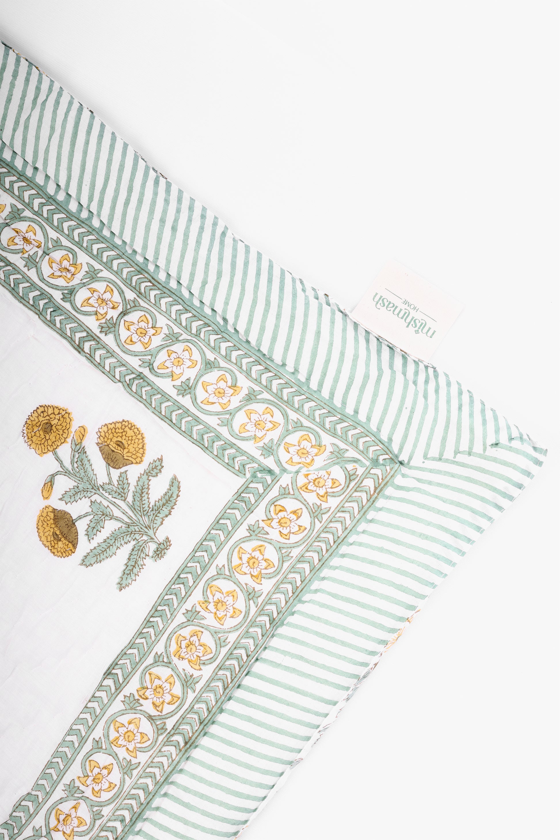 Jaipuri razai with green stripes and floral print on a white background. Buy quilts and comforters online.