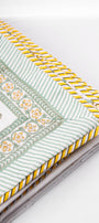 Decorative cotton dohar blanket with floral  design on a white background. buy summer blankets.