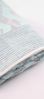 Folded reversible cotton dohar with aqua blue stripes and chevron print