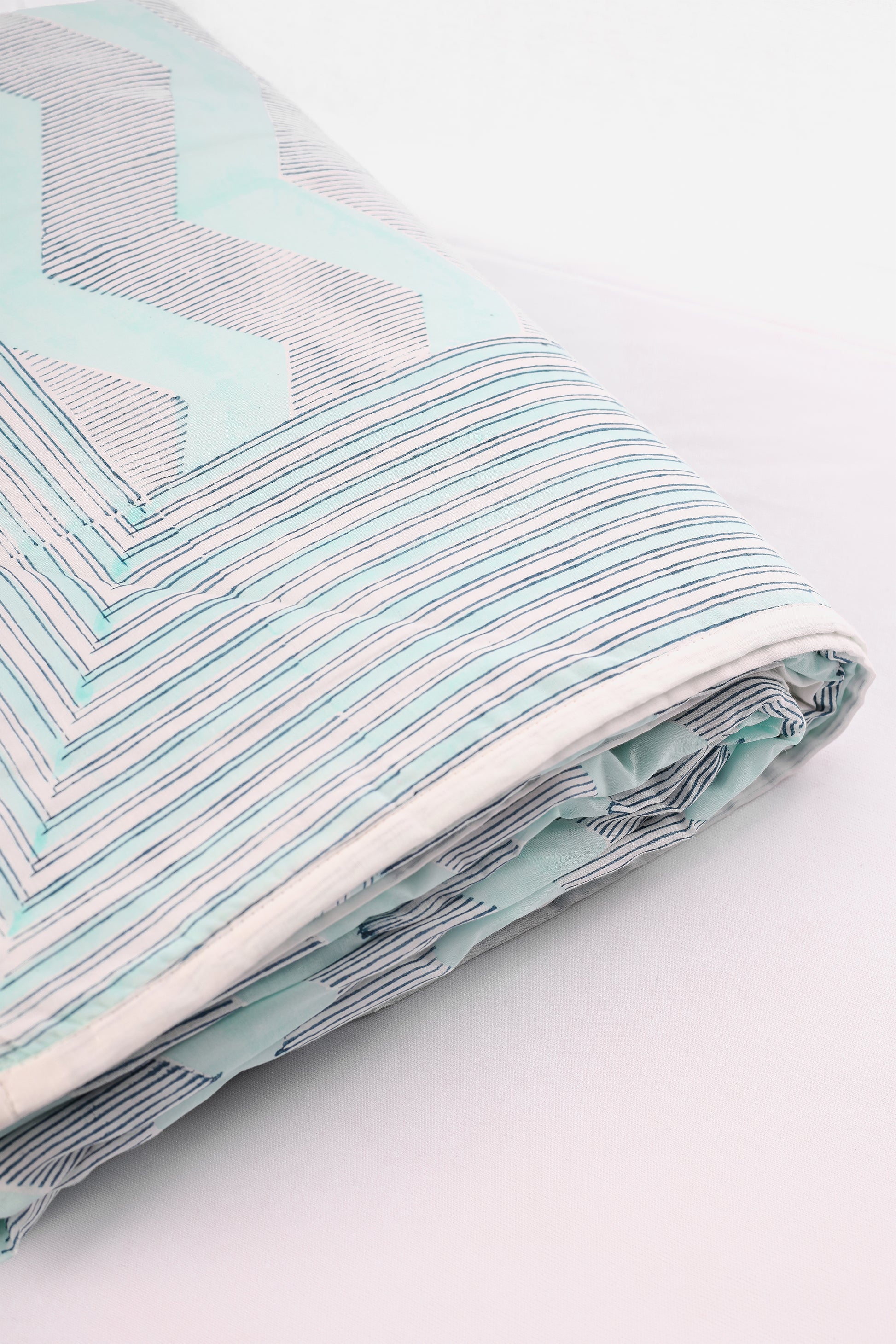 Folded reversible cotton dohar with aqua blue stripes and chevron print