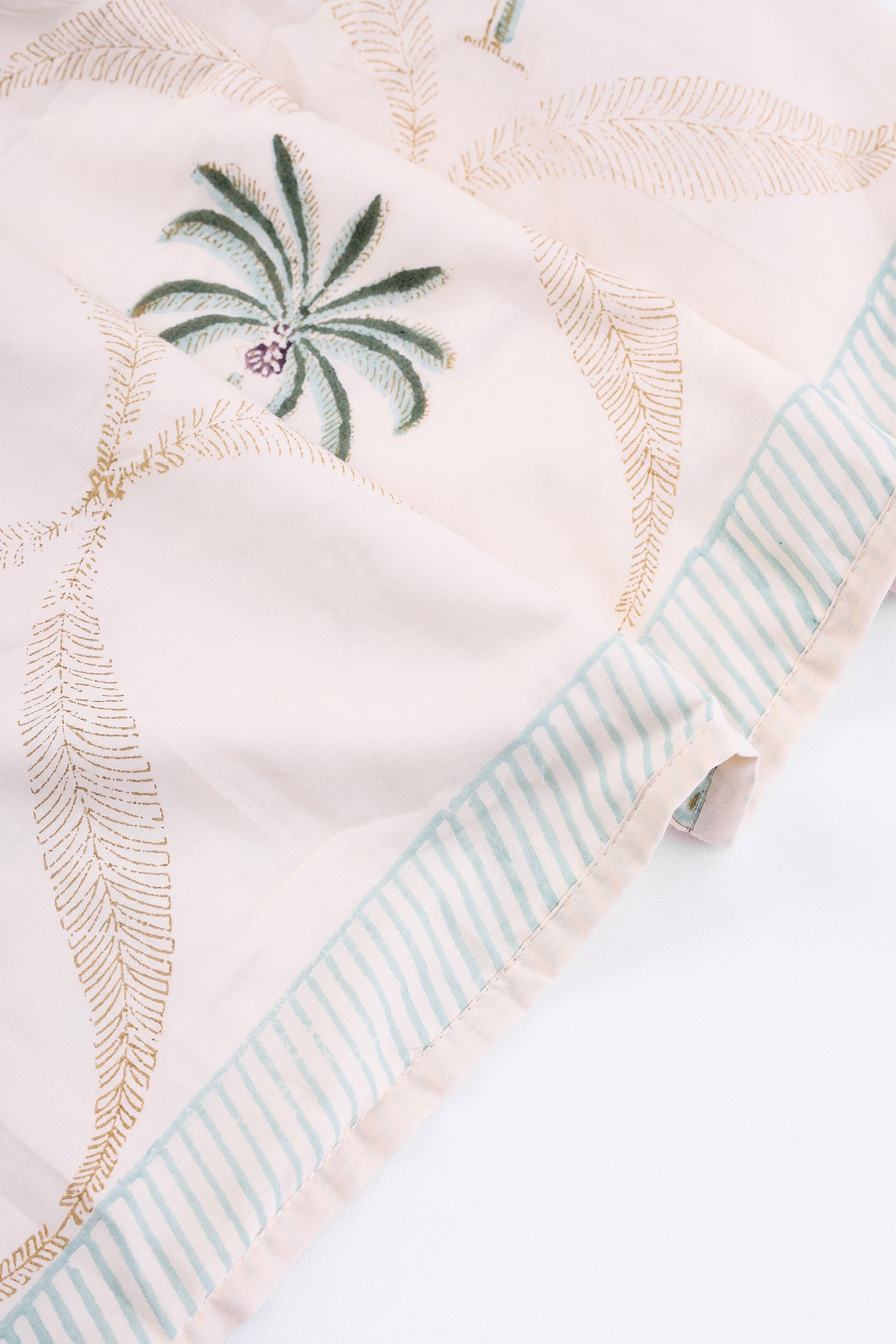 Cotton Dohar with palm tree design and striped pattern on a light yellow mulmul fabric. Buy cotton dohar online.