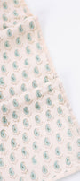 Summer blanket with a pattern of green PAISLEY MOTIFS on a A LIGHT YELLOW DOHAR