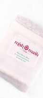 white and grey cotton dohar blanket in a White bag with 'mish mash' branding 