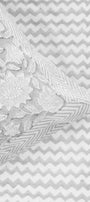 Floral grey pillow on a pure cotton grey bed sheet