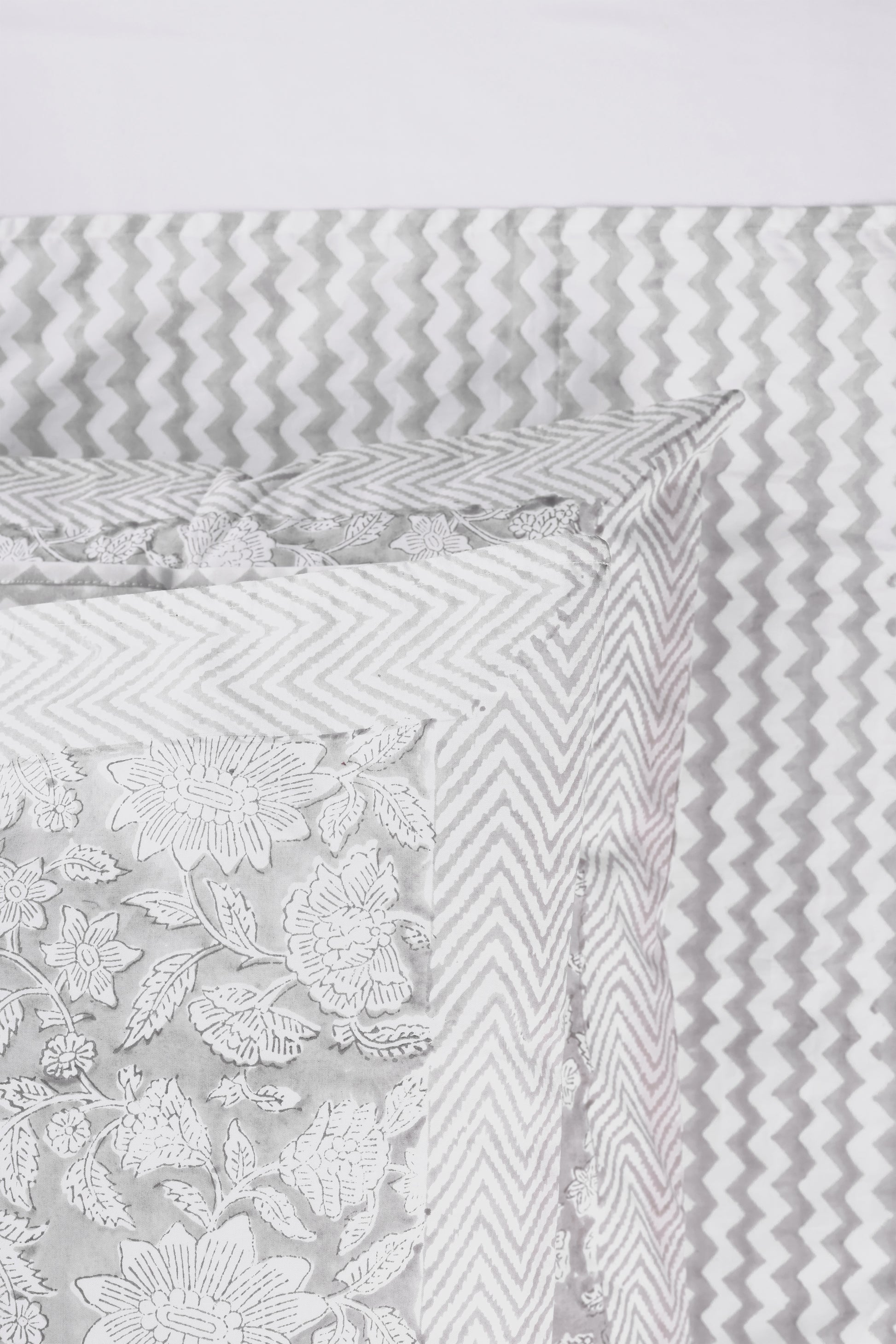 Grey chevron double bed sheet with floral and chevron patterns matching reversible pillows