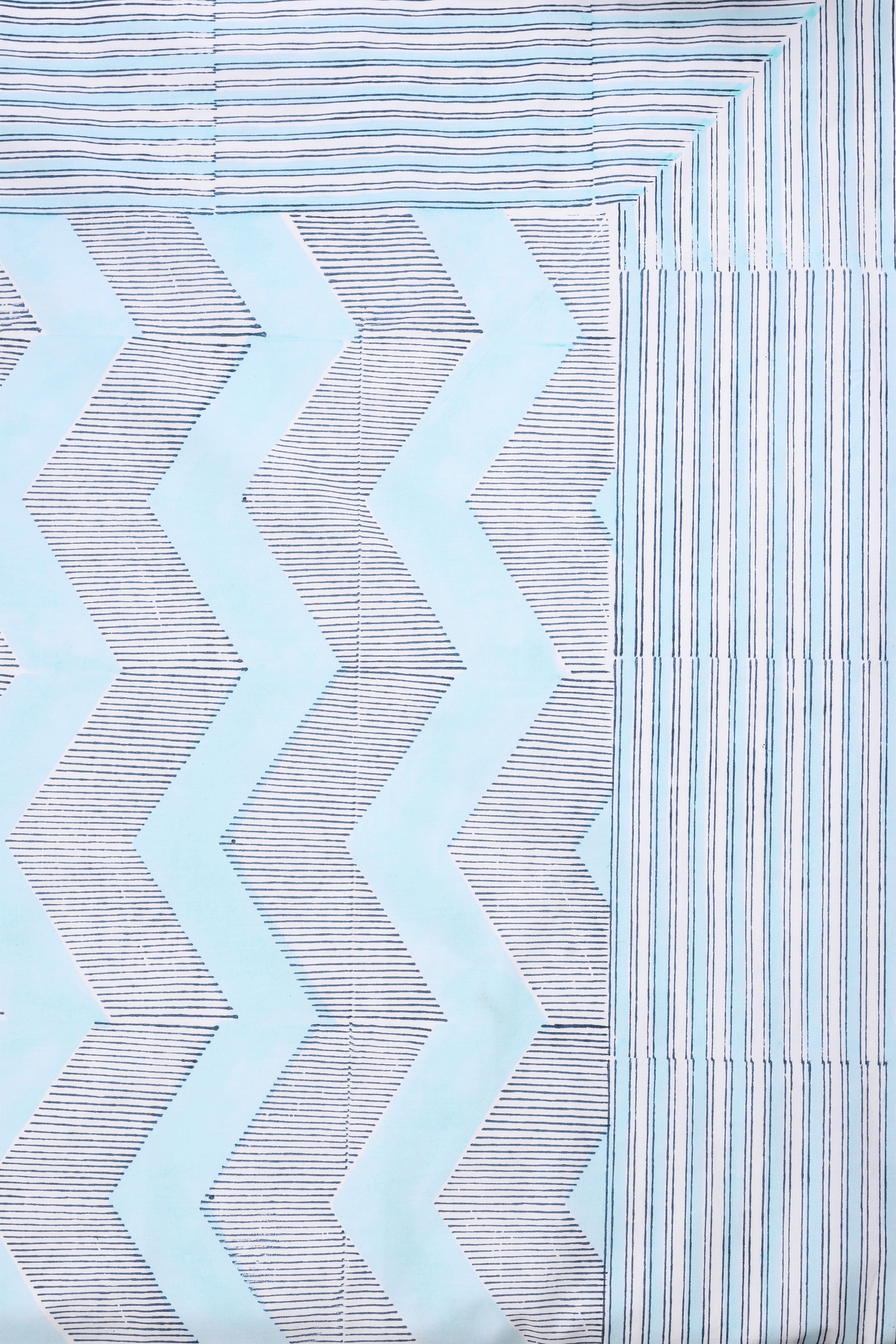 Pure cotton double bed sheet with chevron pattern and striped design in light blue.