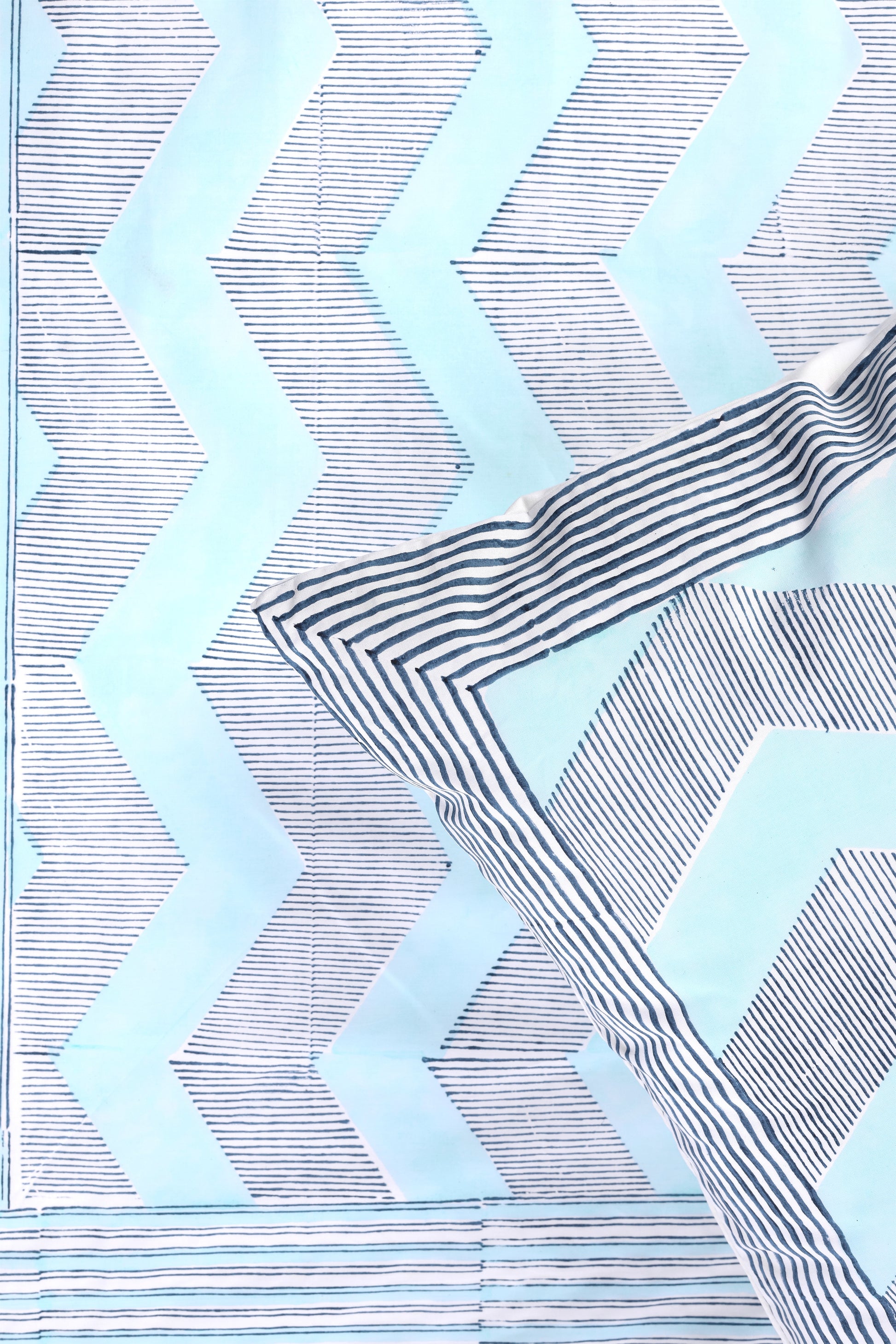 Pure cotton double bed sheet with zigzag pattern in blue on a white cotton base and one matching pillow