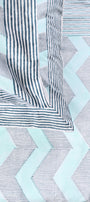 Cotton bed sheet with blue and white geometric design and two matching cotton pillow covers 