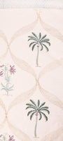 Close-up of a pure cotton double bed bedsheet with floral and geometric patterns on a light background.