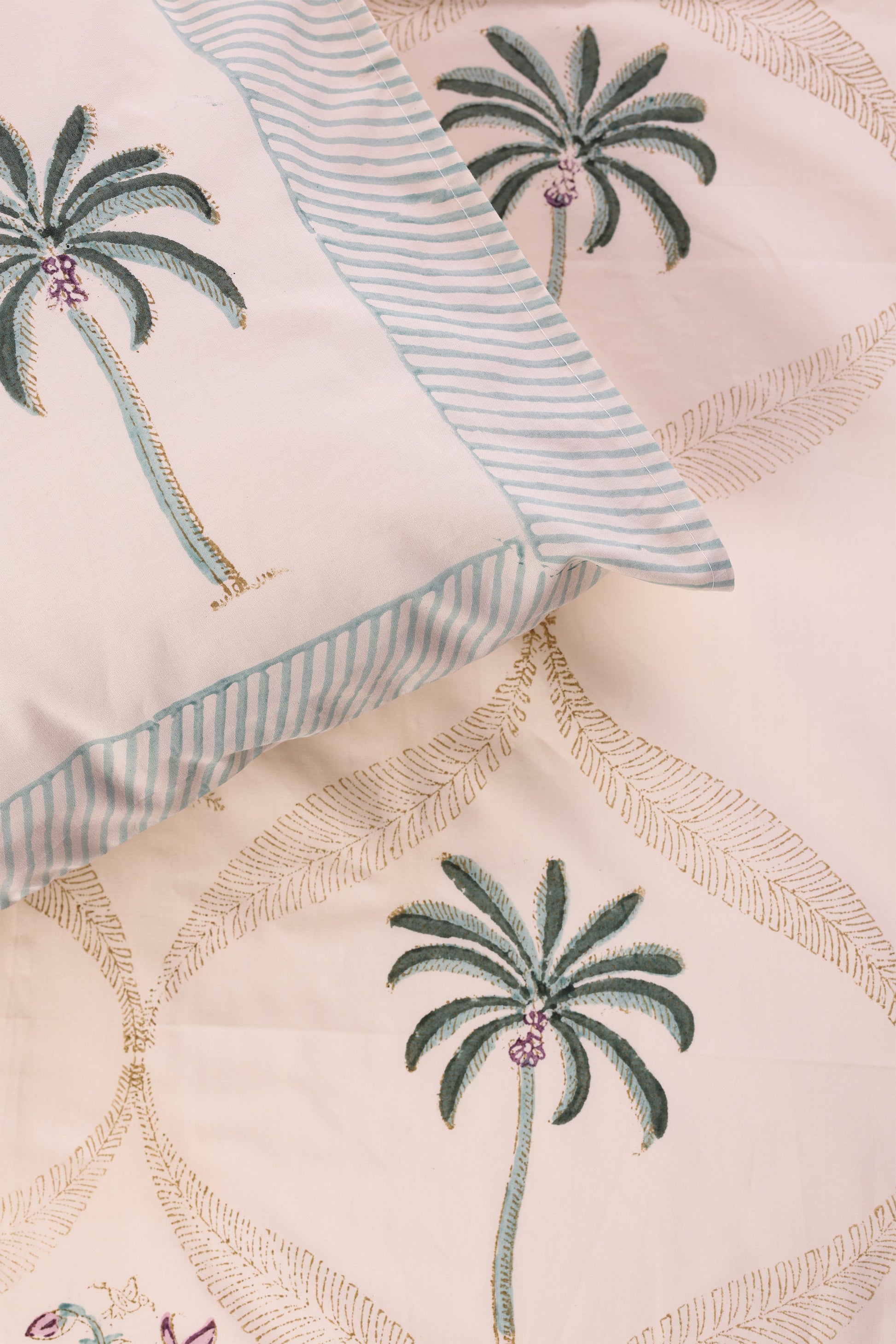 Hand block printed double bedsheet with floral patterns on a beige background