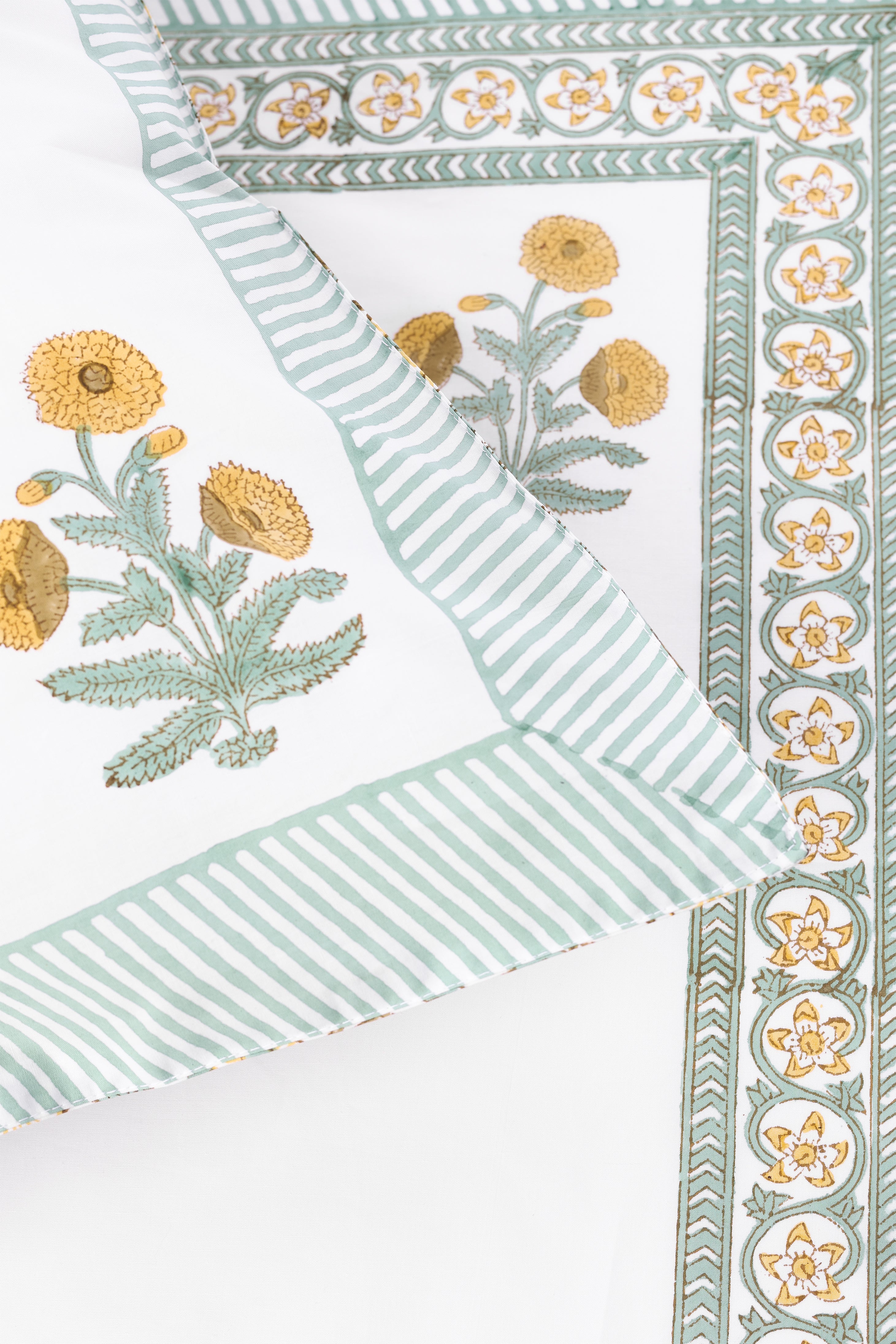 Decorative double bedsheet with floral prints on a white background. buy jaipur bedsheets online.