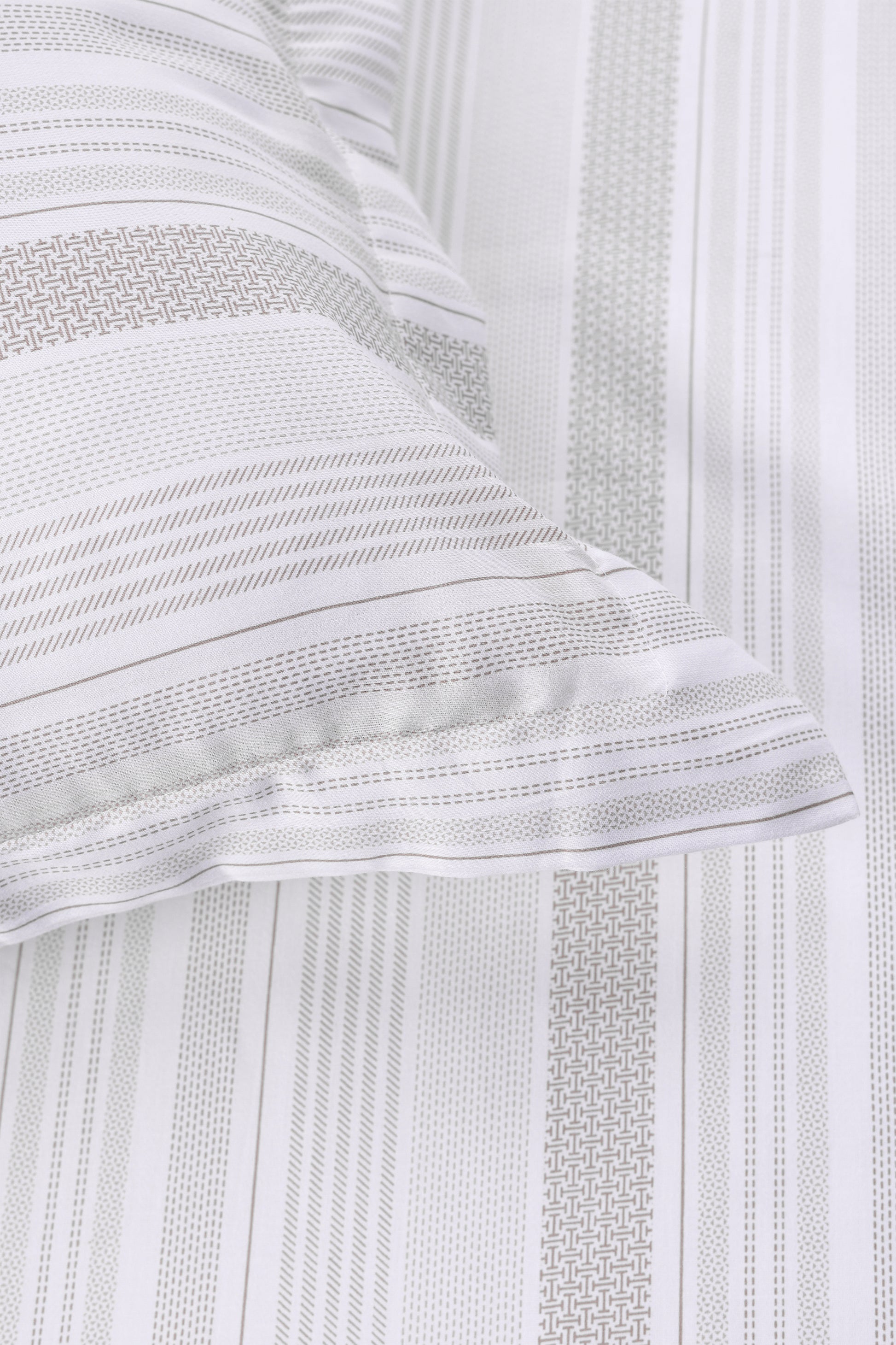 Pure cotton double bed bedsheet in white and beige geometric print with a matching pillow cover.