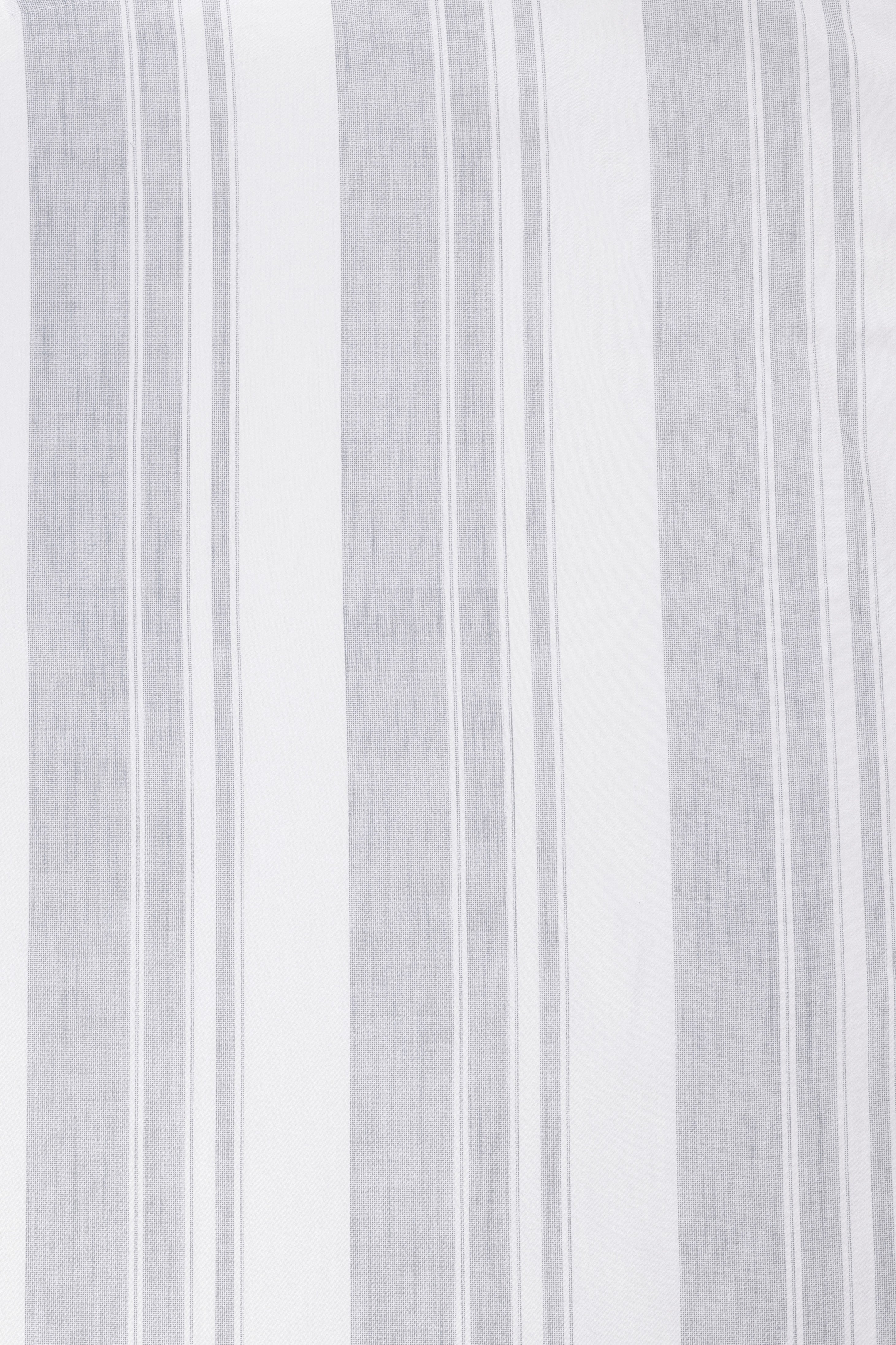 Close-up of a white and ash green double bed bedsheet with vertical stripes. Bombay Dyeing bedsheets