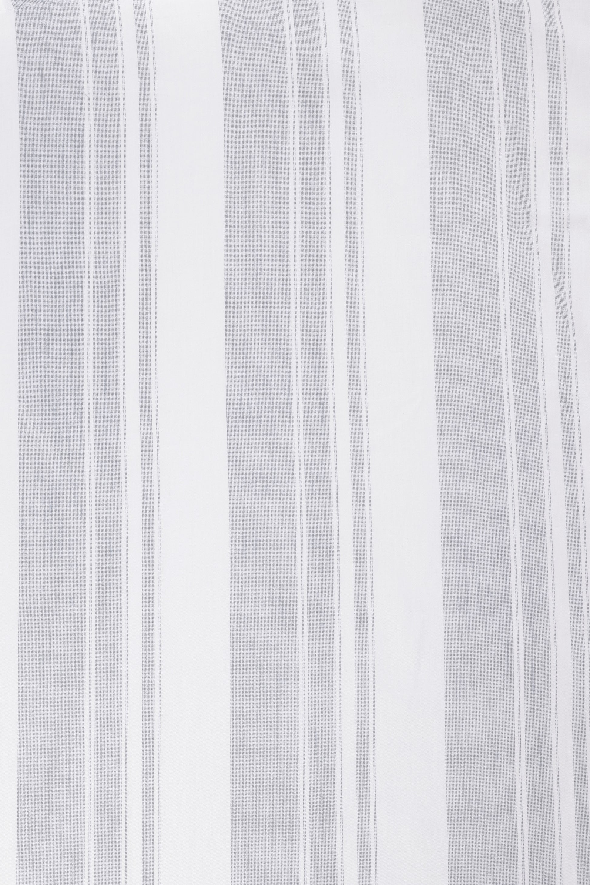 Close-up of a white and ash green double bed bedsheet with vertical stripes. Bombay Dyeing bedsheets