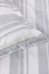 Close-up of a ash green and white striped geomtric pure cotton double bed sheet
