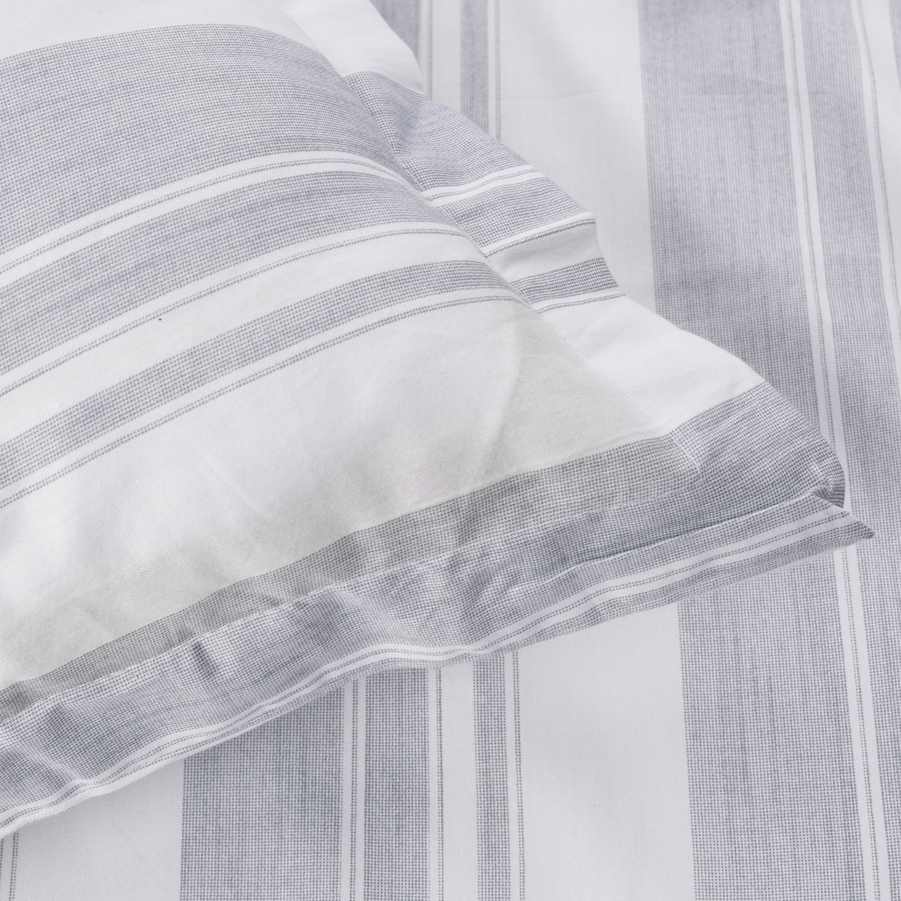 Close-up of a ash green and white striped geomtric pure cotton double bed sheet