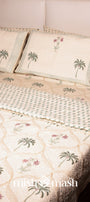 Pure cotton bed sheet with palm tree design and floral motifs with a matching reversible luxury bed spread on top