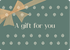 Gift card with a decorative bow and text 'A gift for you' on a green background with subtle patterns.